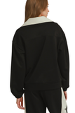 Back view of black CloudKnit half zip pullover with ivory contrast collar and relaxed fit