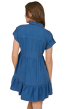Blue denim dress worn by a person on a white background