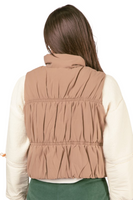 Back of a mini puffer style woman's vest 
