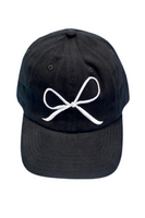 Black baseball hat with a white embroidered bow on the front 