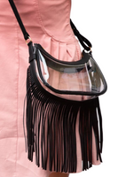 Person wearing a clear crossbody bag with black vegan leather trim and fringe at the bottom of the bag 