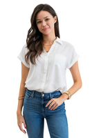 Woman wearing jeans and a white button down short sleeve shirt, there is one front pocket not the shirt 