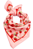 Cherry print bandana scarf with a soft pink base and red border, styled in a knot with a playful allover cherry pattern.