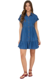 Woman wearing a blue denim dress on a white background