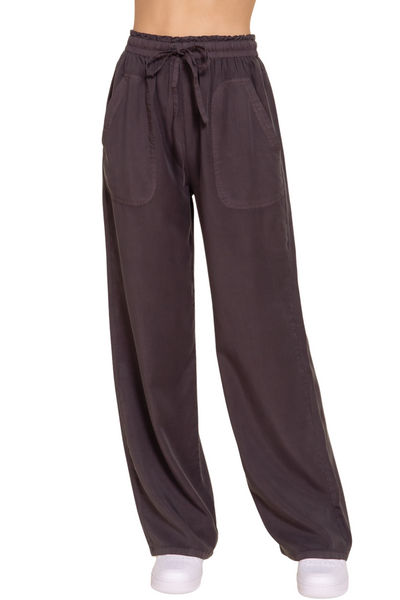 woman wearing charcoal drawstring tencel fabric pants with front pockets