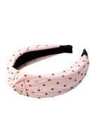 blush tied headband with camel colored embroidered dots