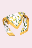 Citrus lemon pattern square scarf with yellow edging styled in a folded display