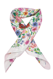 Floral print bandana scarf styled in a folded knot, featuring a colorful mix of pink, blue, and green flowers on a soft white background.