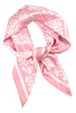 Pink and white paisley print bandana scarf styled in a knot