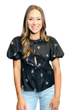 Woman wearing a black top with a round neckline, short puffy sleeves, 3 front tie bow closure, and white bow embroidery