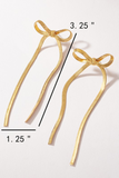 photo of gold herringbone long bow earrings showing the measurements. Earrings are 3.25 inches long by 1.25 inches wide
