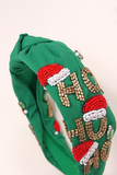 unclose photo of green Christmas headband with ho ho ho in beading and rhinestone detailing 