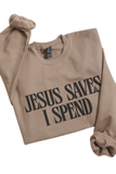 Beige Jesus Saves I Spend crewneck sweatshirt with raised print lettering. Faith-based apparel combining comfort, style, and trendy Christian streetwear.