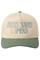 Cream and green trucker-style baseball cap with embroidered teal text on the front that reads, “JESUS SAVES I SPEND.”
