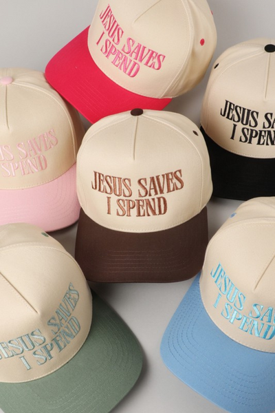 photo of 6 cream trucker hats that are embroidered with "Jesus Saves I Spend" on the front. Hats are 2 toned, the bill is the same color as the embroidery