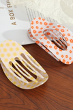 Jumbo lay flat hair claw clips featuring yellow sun and orange floral patterns