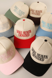 Assorted two-tone “Make Heaven Crowded” trucker hats with embroidered lettering, available in multiple colors including red, pink, green, blue, black, and brown.