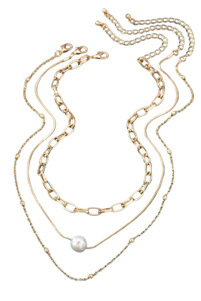 gold necklace set. set includes three individual necklaces, an oval link chain, a snake chain with a pearl, and a beaded chain necklace