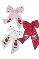 Oversized hair bows in colors pink, white and red. Bows have rhinestones and seed bead nutcrackers 