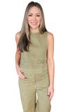 A woman modeling a sleeveless olive green jumpsuit with front flap pockets and gold-tone button details, set against a plain white background.