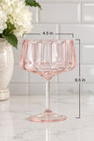 A pink fluted stem glass with dimension overlays showing a width of 4.5 in and a height of 6.