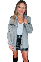 Woman wearing a white shirt, leather mini skirt and a washed out gray denim jacket with raw hem detailing