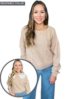 Woman wearing a beige cable knit sweater with long sleeves and a relaxed fit. The sweater features a removable white collar, shown in the inset image where the same sweater is styled with the collar attached. She pairs the sweater with light blue wide-leg jeans.