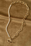 Gold toggle closure necklace. Half of the necklace is a rhinestone chain, the other half is an oval link chain. 