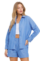 girl wearing a blue and white striped long sleeve button down shirt with matching shorts 