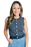 woman wearing a navy blue and white striped sweater vest with a crew neckline and wooden buttons down the front 
