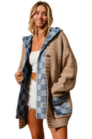 woman wearing a checkered denim jacket with a tan colored cardigan sweater. Cardigan has checkered denim pattern on pockets