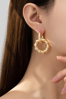 photo of a woman ear wearing Gold hinge earrings with rope textured hoop drops