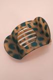 Tortoise shell lay flat hair claw clip with curved matte design and strong grip for comfortable all day styling