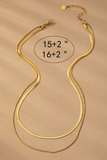Layered gold necklace, shorter chain is a gold herringbone chain, longer chain is a thin snake chain. Necklaces are joined by one clasp. Measurements are shown: herringbone chain- 15 inches, snake chain- 16 inches. clasp has a 2 inch extender 