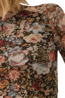 Upclose photo of a knit semi sheer floral top 