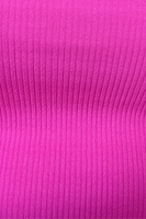 Up close picture of fabric. Fabric is from a shorts and tank top lounge set. Fabric is hot pink and ribbed. 
