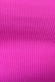 Up close picture of fabric. Fabric is from a shorts and tank top lounge set. Fabric is hot pink and ribbed. 