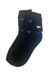 A pair of low-cut black socks with small purple and white heart patterns, shown against a plain white background.