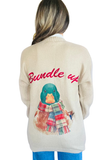 Back view of the Bundle Up Mallard Cardigan Sweater in cream, featuring a colorful mallard duck wearing a plaid scarf and red "Bundle Up" lettering.