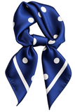 A royal blue silk scarf with white polka dots and diagonal white stripes, styled in a knot on a solid white background.