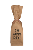 A brown kraft paper gift bag tied with red-and-white string, printed with the words 'OH HAPPY DAY!' in bold black letters, on a plain white background.