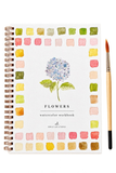A spiral-bound watercolor workbook titled 'FLOWERS' with a central blue hydrangea illustration and a border of painted color swatches. A paintbrush with orange bristles and a light wood handle rests to the right on a white background.