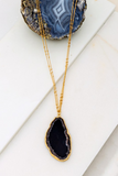 Black agate pendant stone necklace on a gold double chain necklace