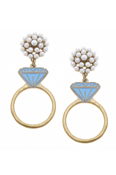 earrings with a blue Diamond on gold band ring hanging from a pearl cluster earrings