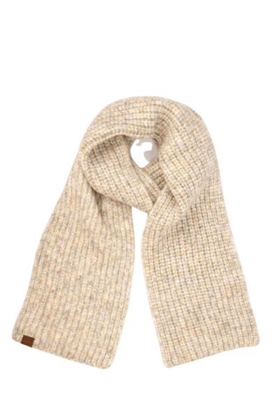 Knitted oatmeal colored scarf on a white background, scarf has a leather tag sewn onto the left bottom side of scarf