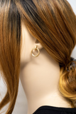 Gold double circle stud earrings on a mannequin