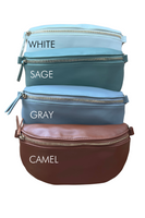 Leather bum bags lined up vertically. Bum bags have a gold front zipper closure with a leather pull tag. Bags proceed in the order of color: white, sage, gray, and camel 