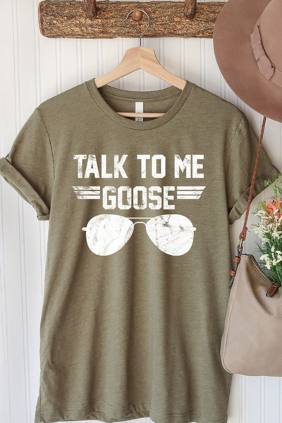 olive green Top Gun inspired "talk to me goose" graphic t-shirt with aviator sunglasses glasses, hanging on wooden hanger 
