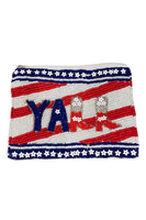 red white an blue beaded bag. white and red diagonal striped made out of beads with a navy blue star and beaded border in top of bottom. Yall written with the two L's as cowboy boots